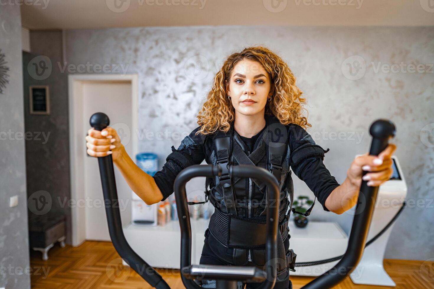 Woman doing creative workouts in a modern studio photo