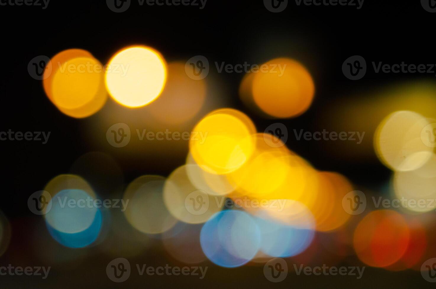 blurred background of night city and roads orange red and blue side lights and roads. High quality photo