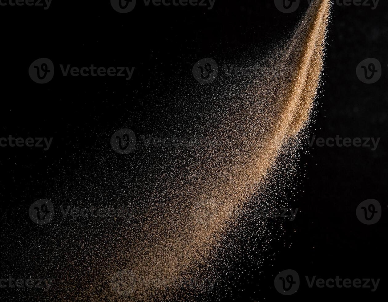 Fine Brown Sand Scattered on Black Background, Front View photo