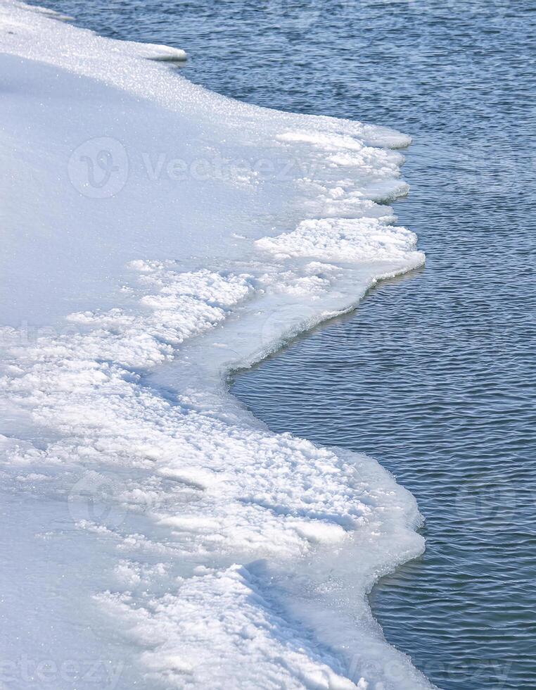 Breathtaking Frozen Seascape with Unique Ice Textures and Blue Horizon photo