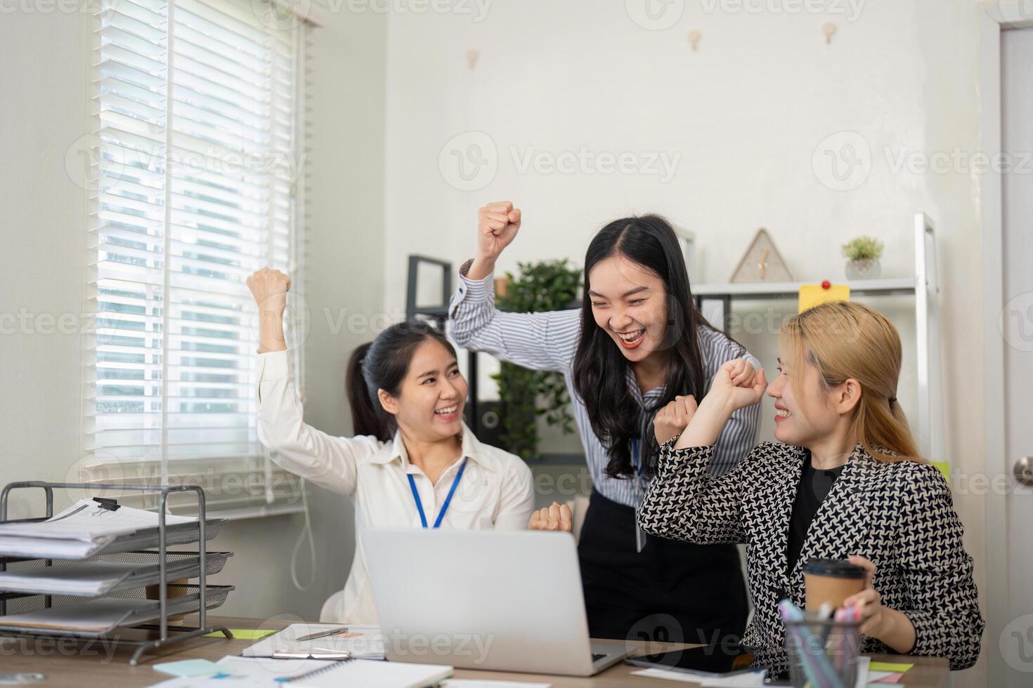 Team celebration of business success office environment digital content collaborative workspace positive energy photo