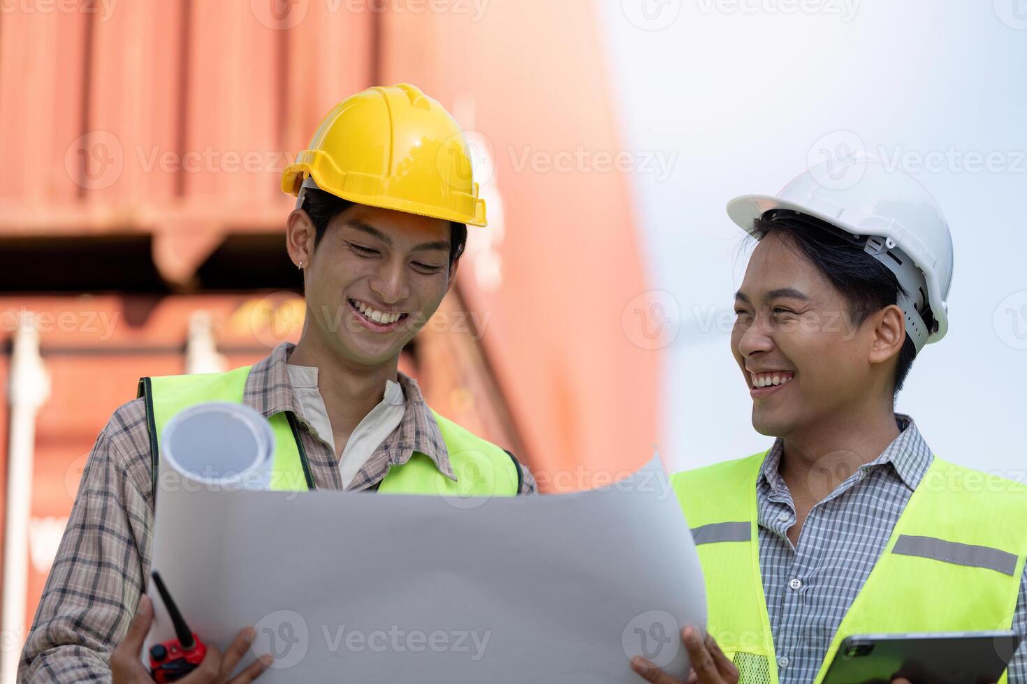 Engineers collaborating on logistics plans at construction site urban environment technical analysis professional viewpoint photo