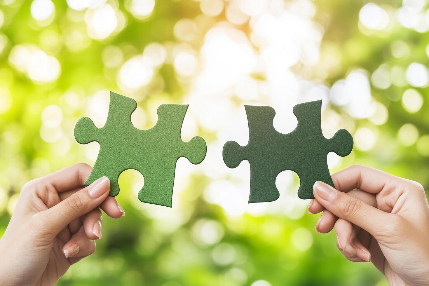 Two Hands Holding Green Jigsaw Puzzle Pieces for Business Solution Concept in Nature Background photo