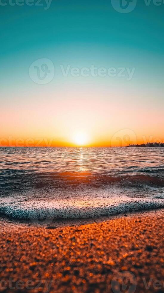 stunning sunset over ocean with gentle waves reflecting warm colors. tranquil scene evokes sense of peace and beauty, perfect for relaxation and inspiration photo
