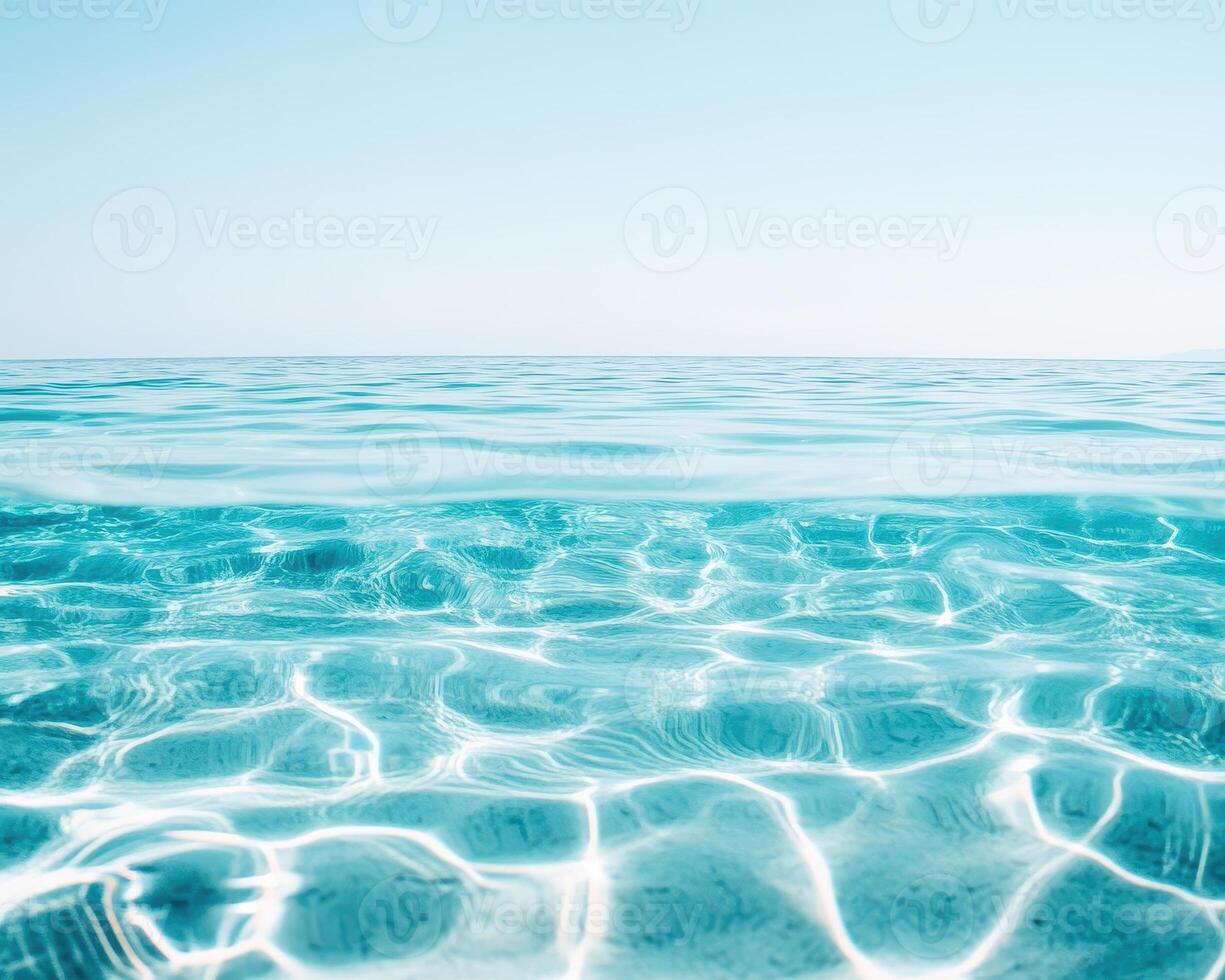 Crystal clear turquoise water ripples gently under bright sky, creating serene and tranquil atmosphere. sunlight dances on surface, enhancing beauty of ocean photo