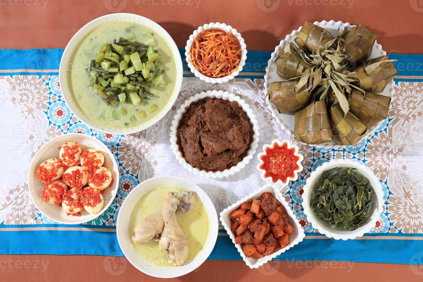Traditional Indonesian Menu during Eid al Fitr, Ketupat Lebaran, Rendang, Opor, Sambal Goreng. photo