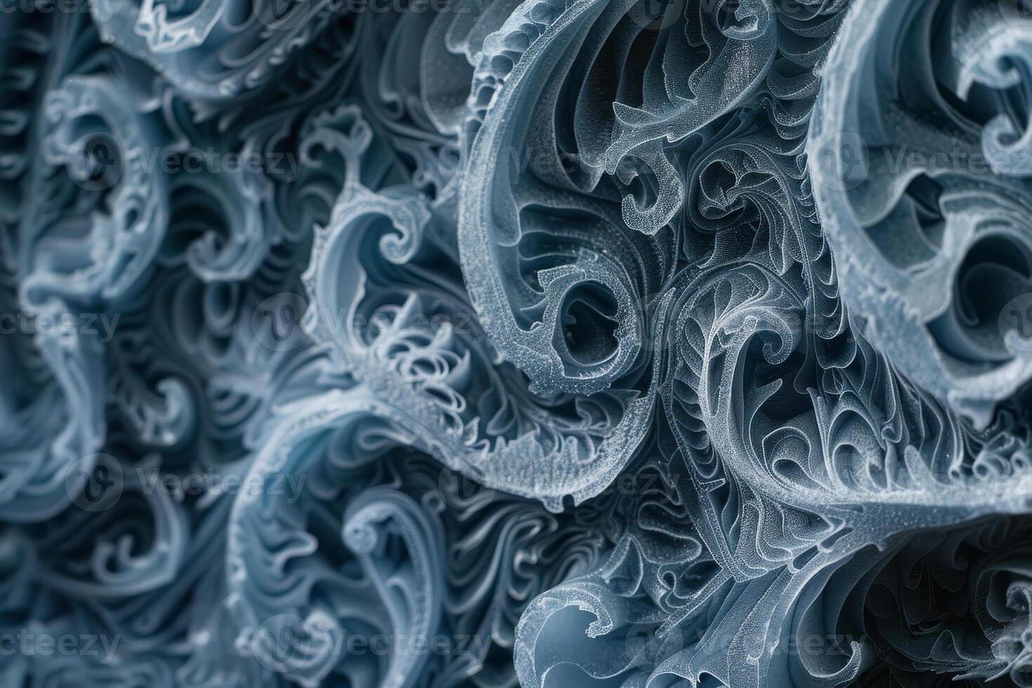 Delicate frosty patterns emerge on a chilled surface, showcasing swirling shapes and intricate designs that reflect the beauty of winter photo