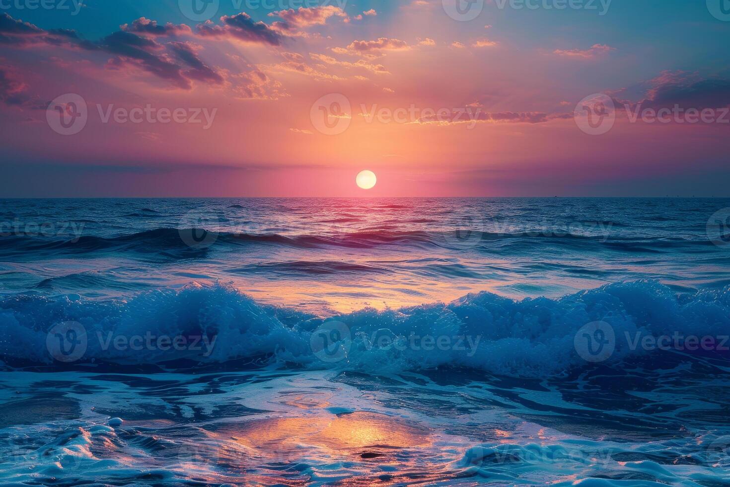A sunset over the ocean with waves and a sunset photo