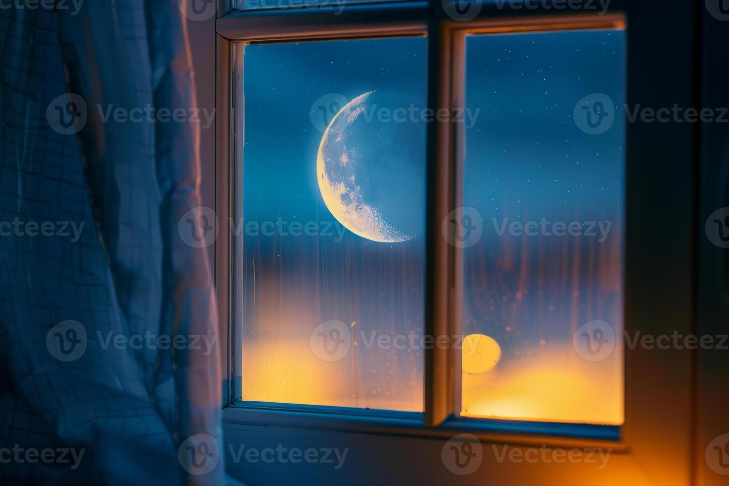 Looking out from a softly lit room, the luminous moon illuminates the night sky, creating a peaceful atmosphere as it hangs over the horizon photo