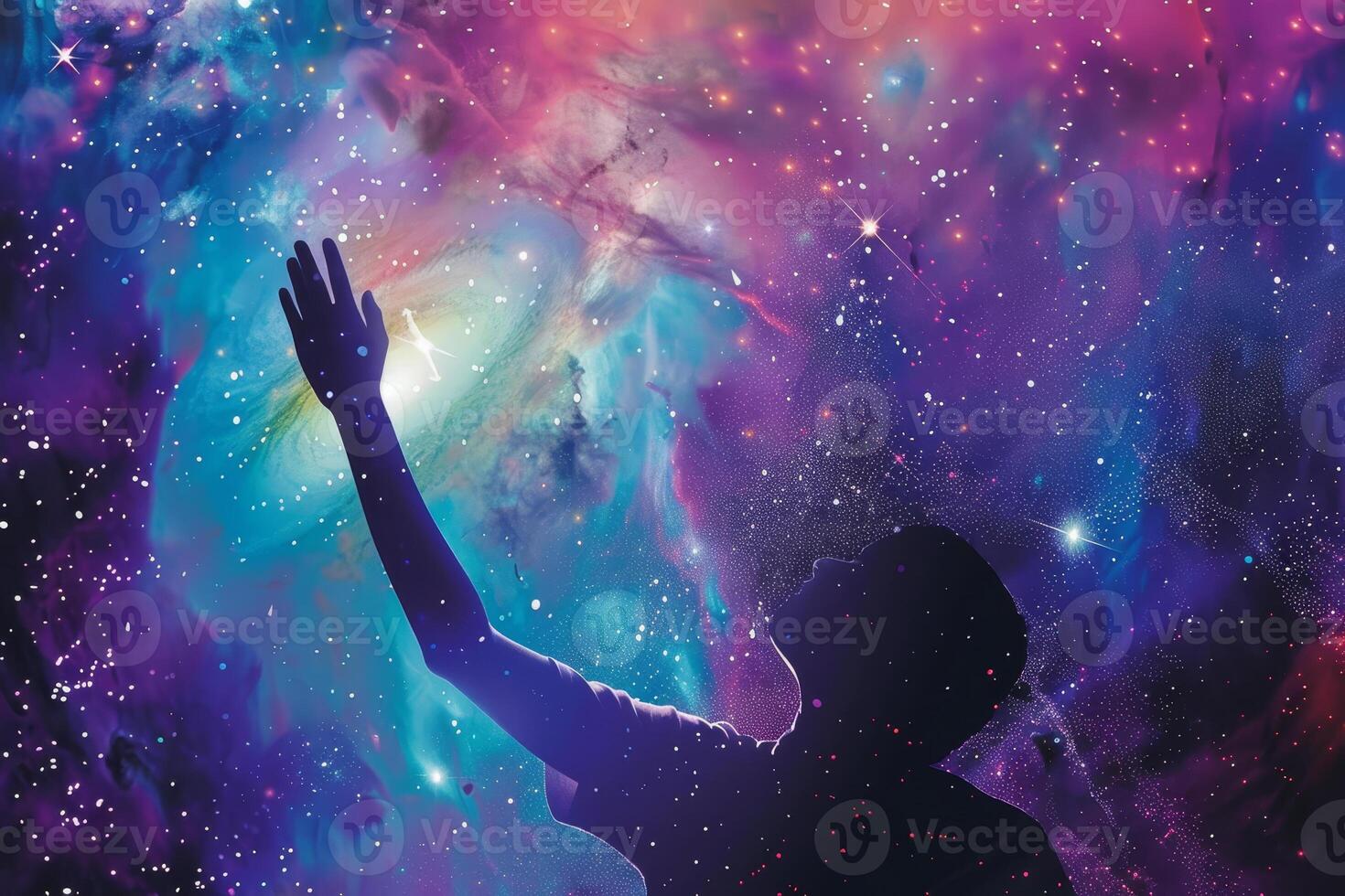 A person reaching up to the stars in the galaxy photo