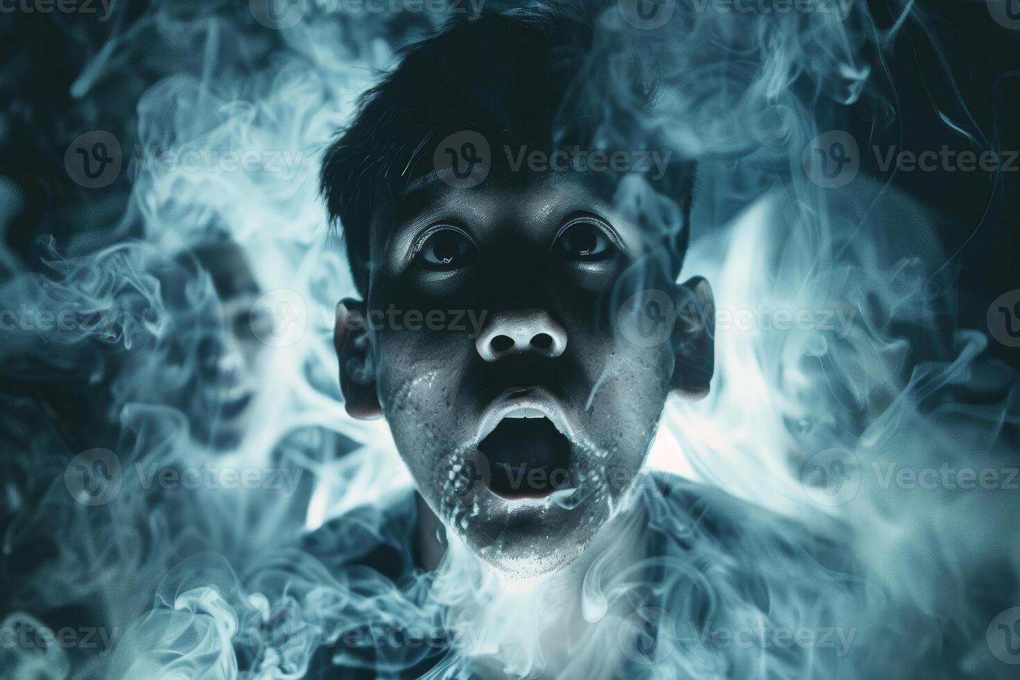 A man is surrounded by smoke and is looking up photo