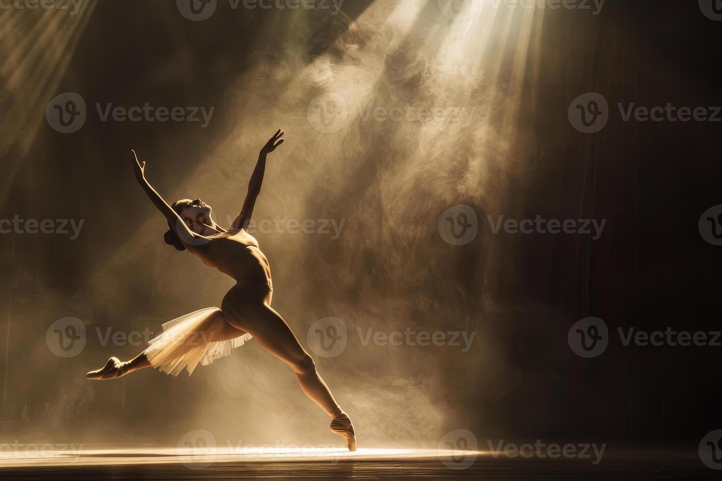A young ballerina in silhouette on a stage photo