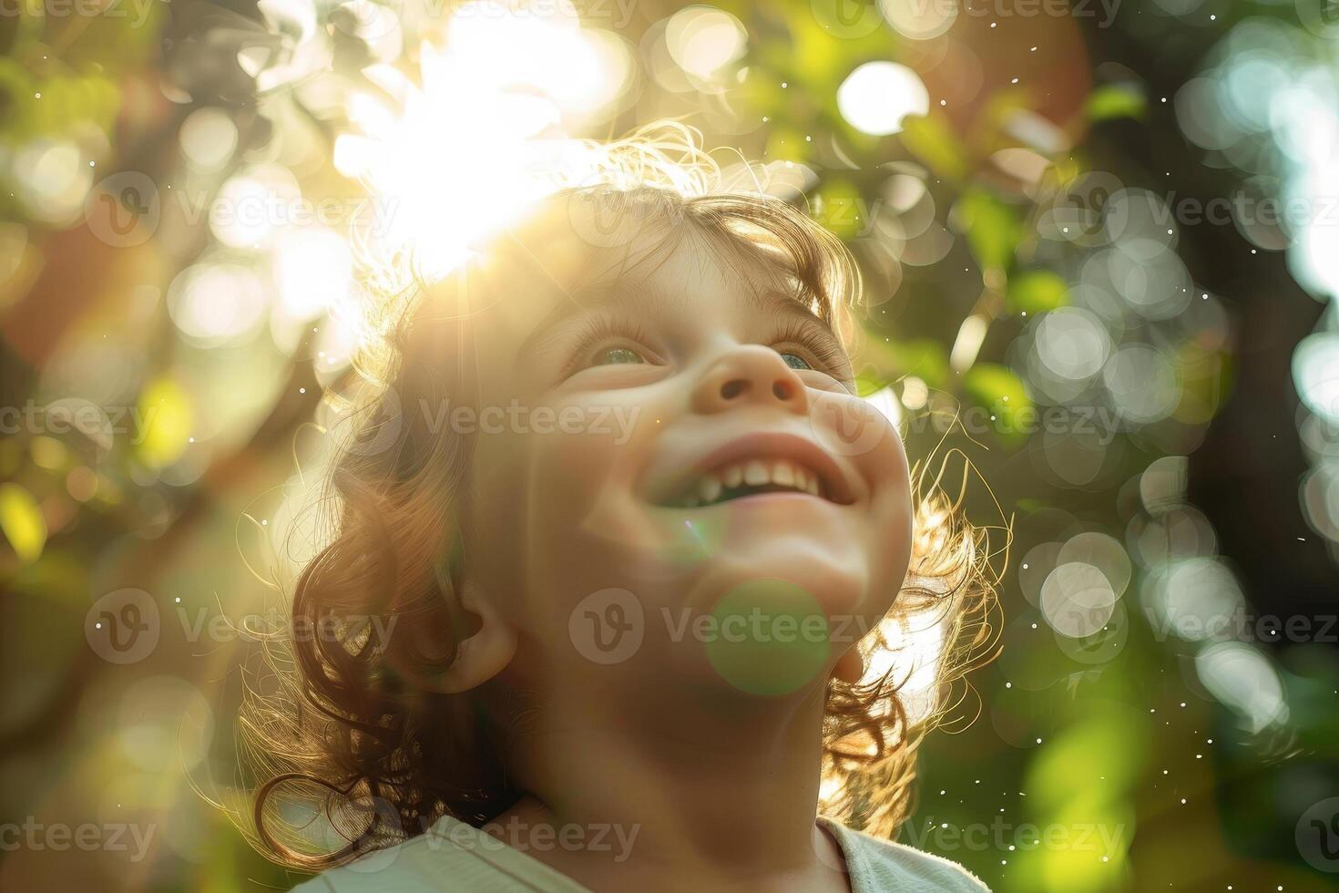 A young child is smiling in the sun photo