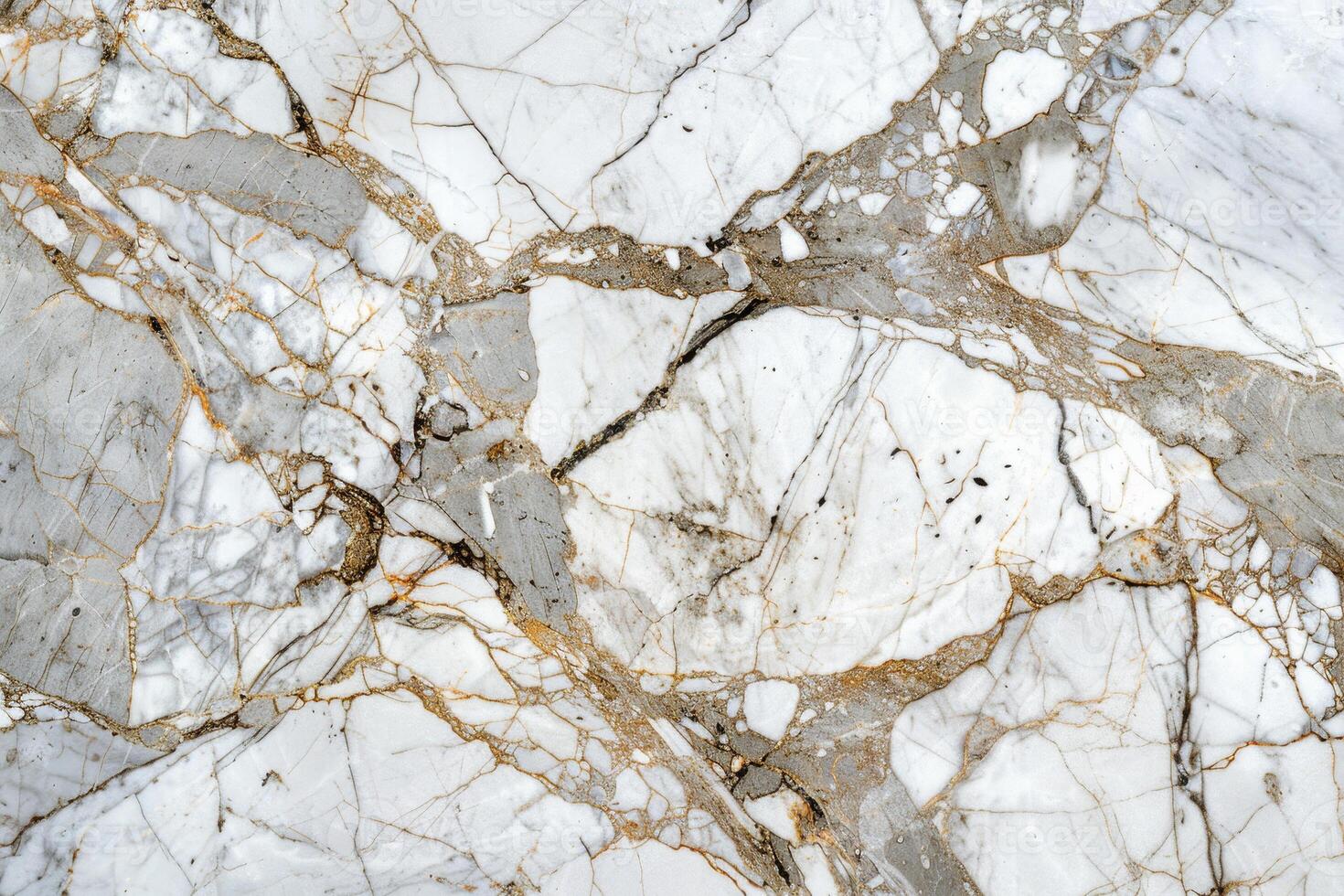 A close up of a marble surface with gold and white paint photo