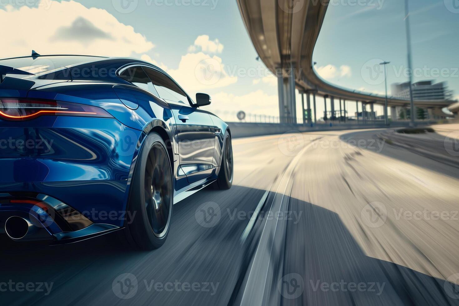 The rear end of a blue sports car driving on the highway photo
