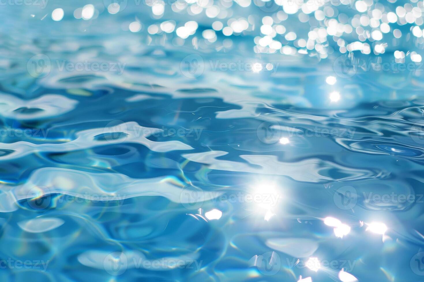 The water is calm and clear, with a few ripples on the surface photo