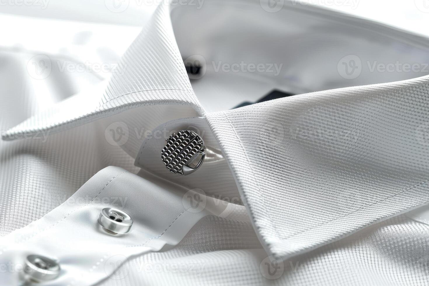 A close up of a white shirt with a button photo