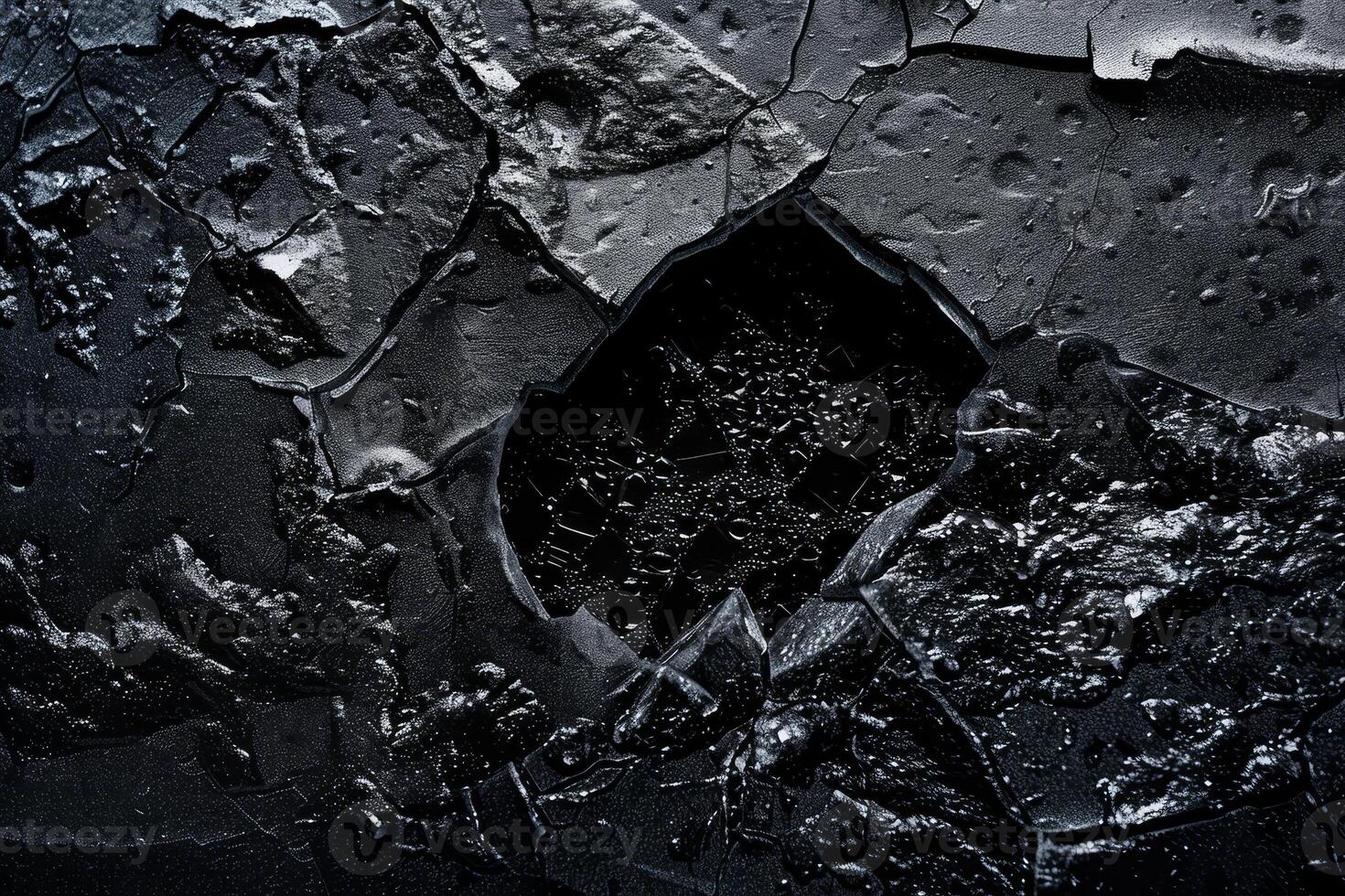A black and white photo of a cracked wall