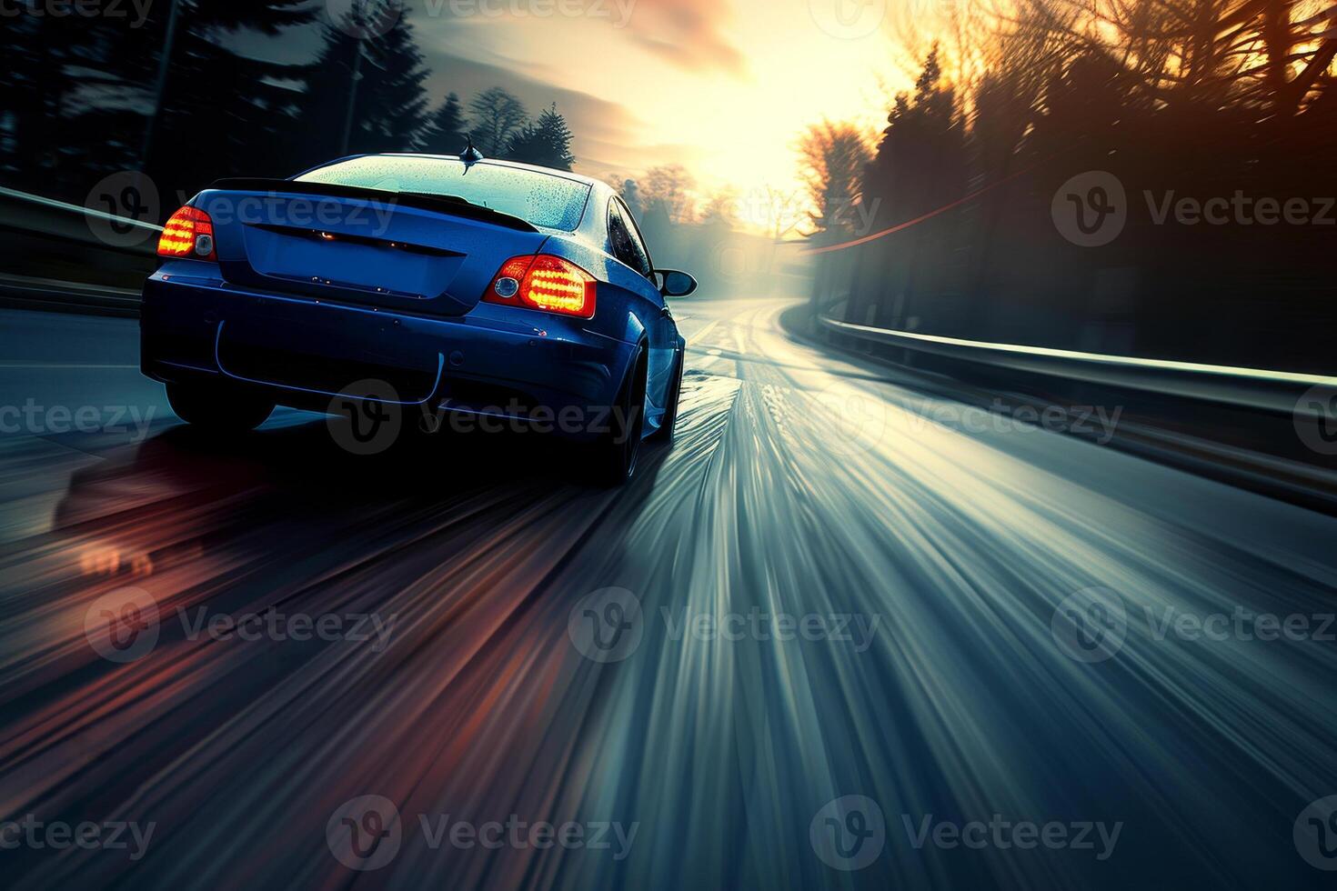 A car driving on a road at sunset photo