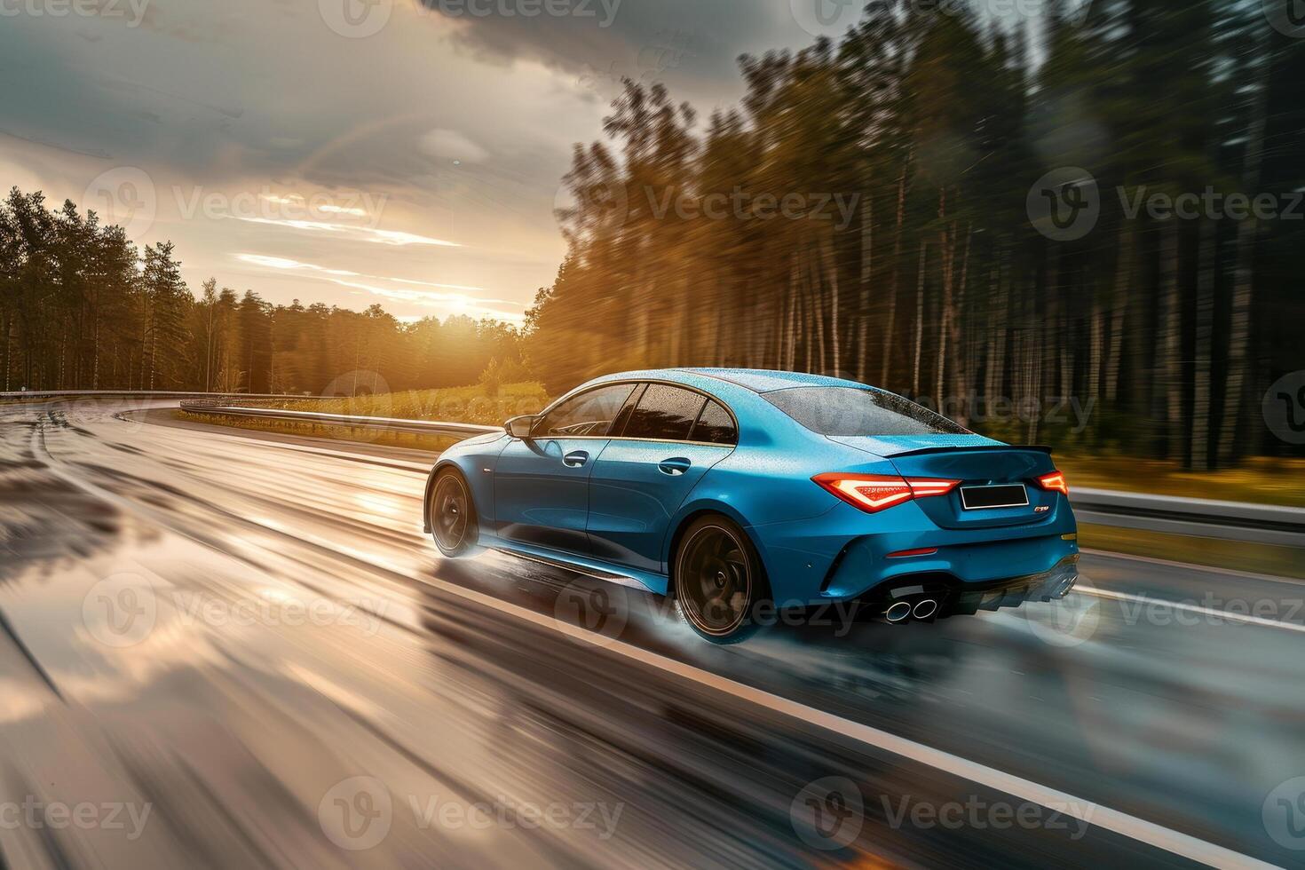 The blue mercedes s class driving on a wet road photo