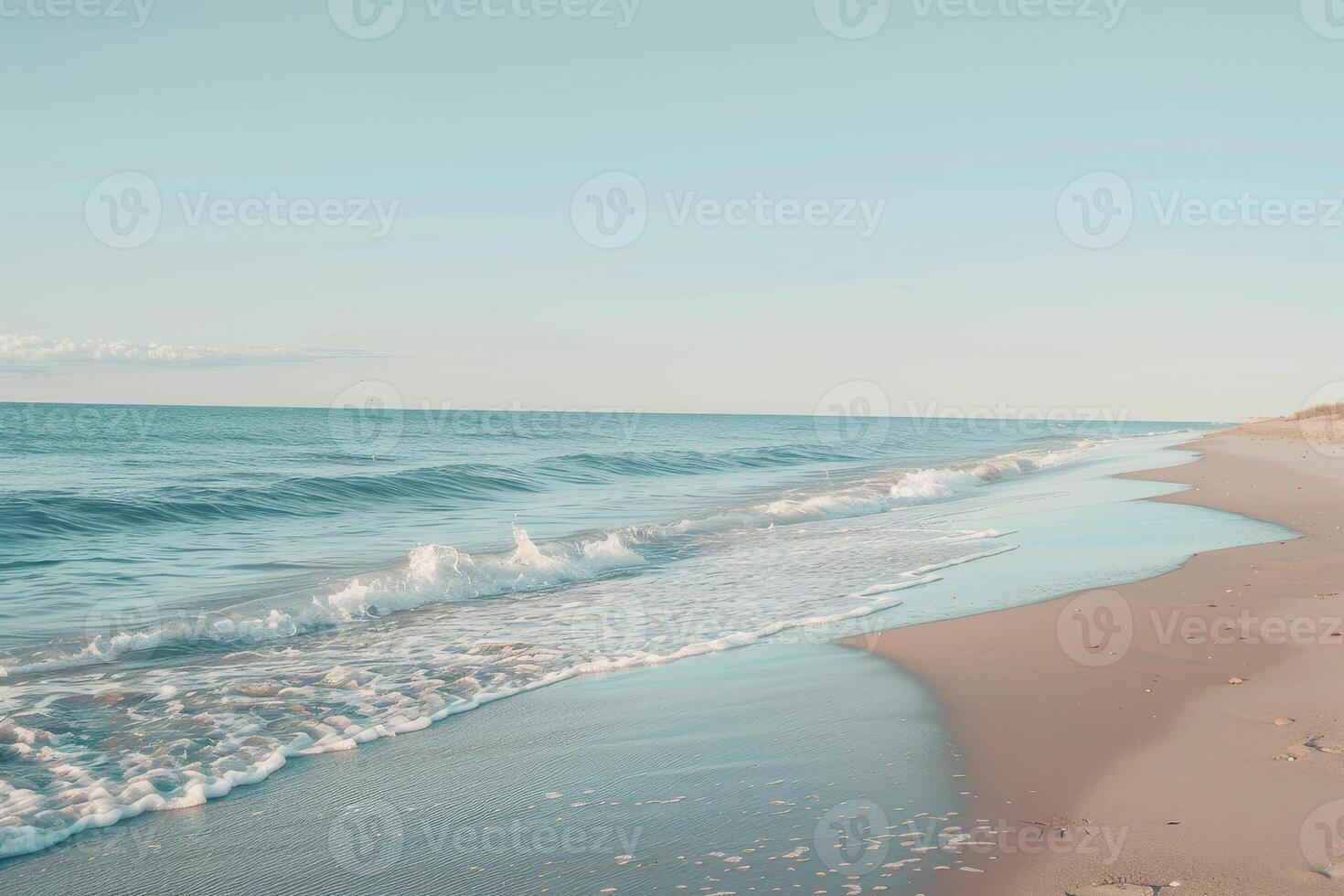 The ocean is calm and the sky is clear photo