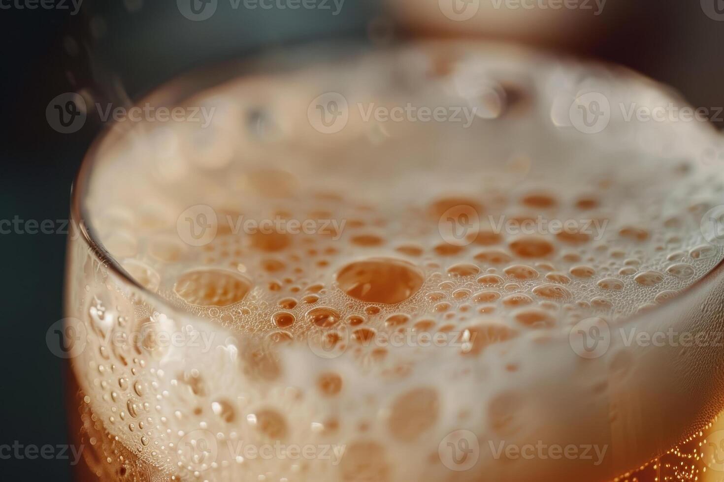 A close up of a glass of beer with bubbles photo