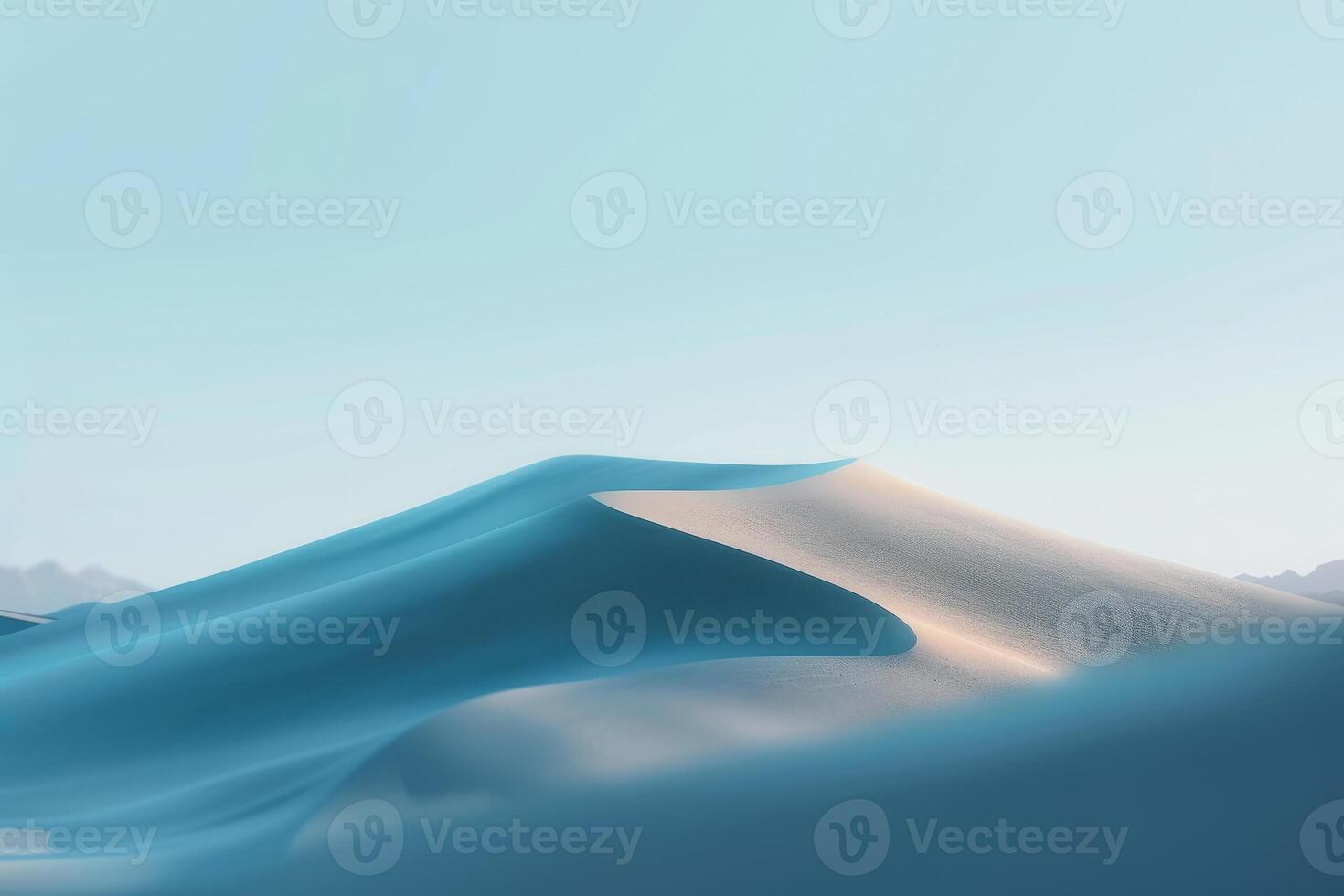 A blue sand dune in the desert with a blue sky photo