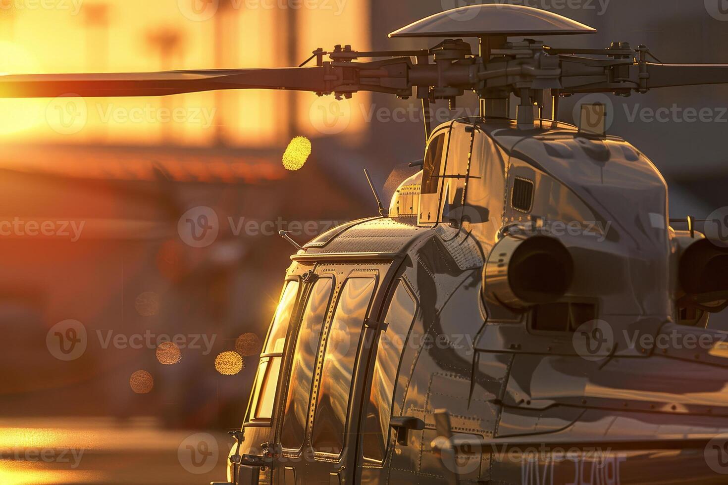 A helicopter stands idle at a nearby airstrip, illuminated by the vibrant hues of sunset, showcasing the beauty of evening light reflecting off its surface photo
