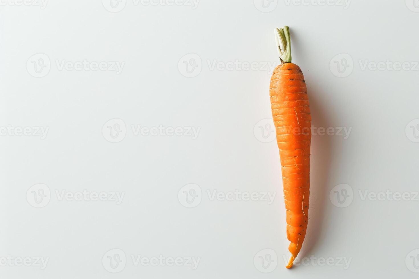 A vibrant orange carrot stands upright against a light background, showcasing its fresh texture and natural shape, indicative of farm-to-table produce photo