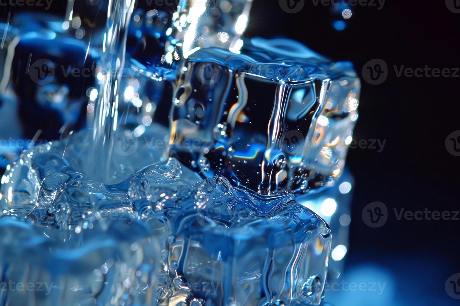 Water streams beautifully over ice cubes, reflecting light in a vibrant display. This captivating scene showcases the contrast between the cool ice and flowing water photo