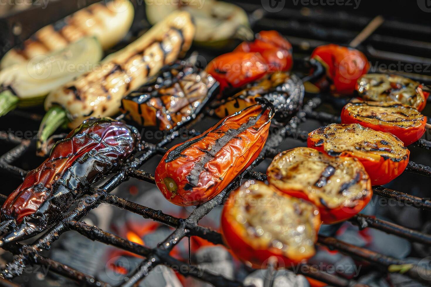 A variety of colorful vegetables, including peppers and tomatoes, are sizzling on a grill, showcasing grill marks and caramelization, perfect for summer meals photo