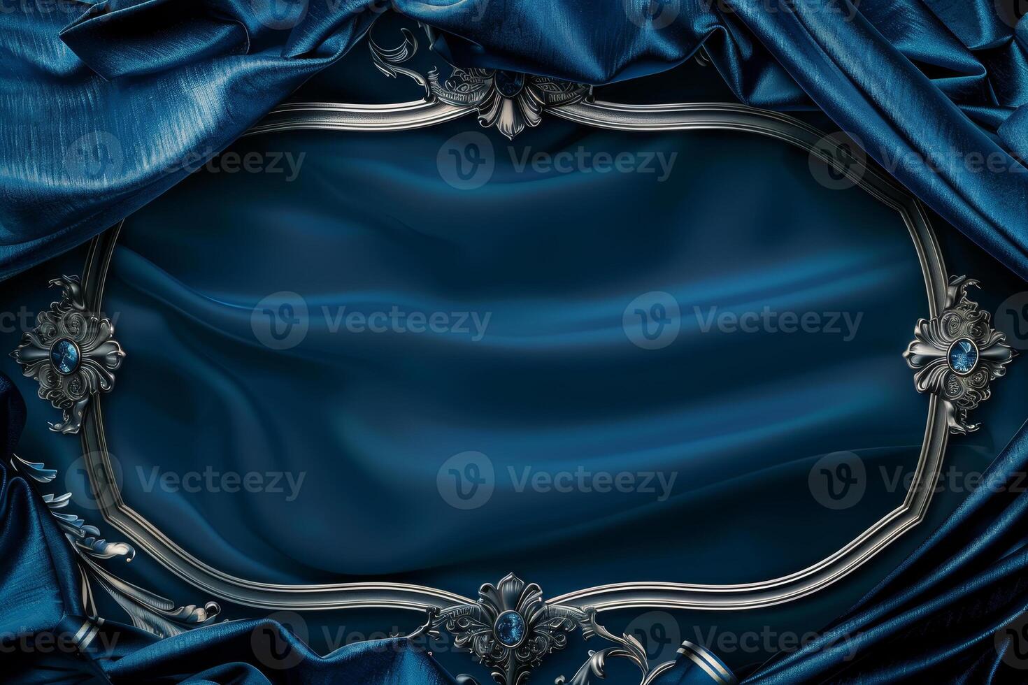A striking silver frame is surrounded by deep blue velvet drapery, creating an elegant setting perfect for showcasing artwork or formal announcements. The rich texture enhances the atmosphere photo