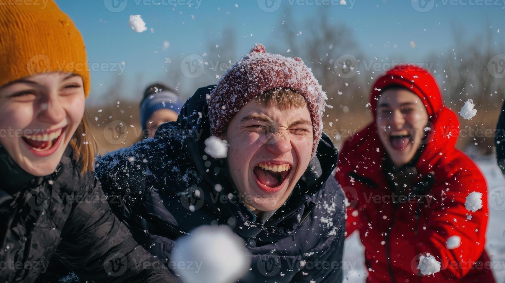 A group of young people having fun in the snow photo