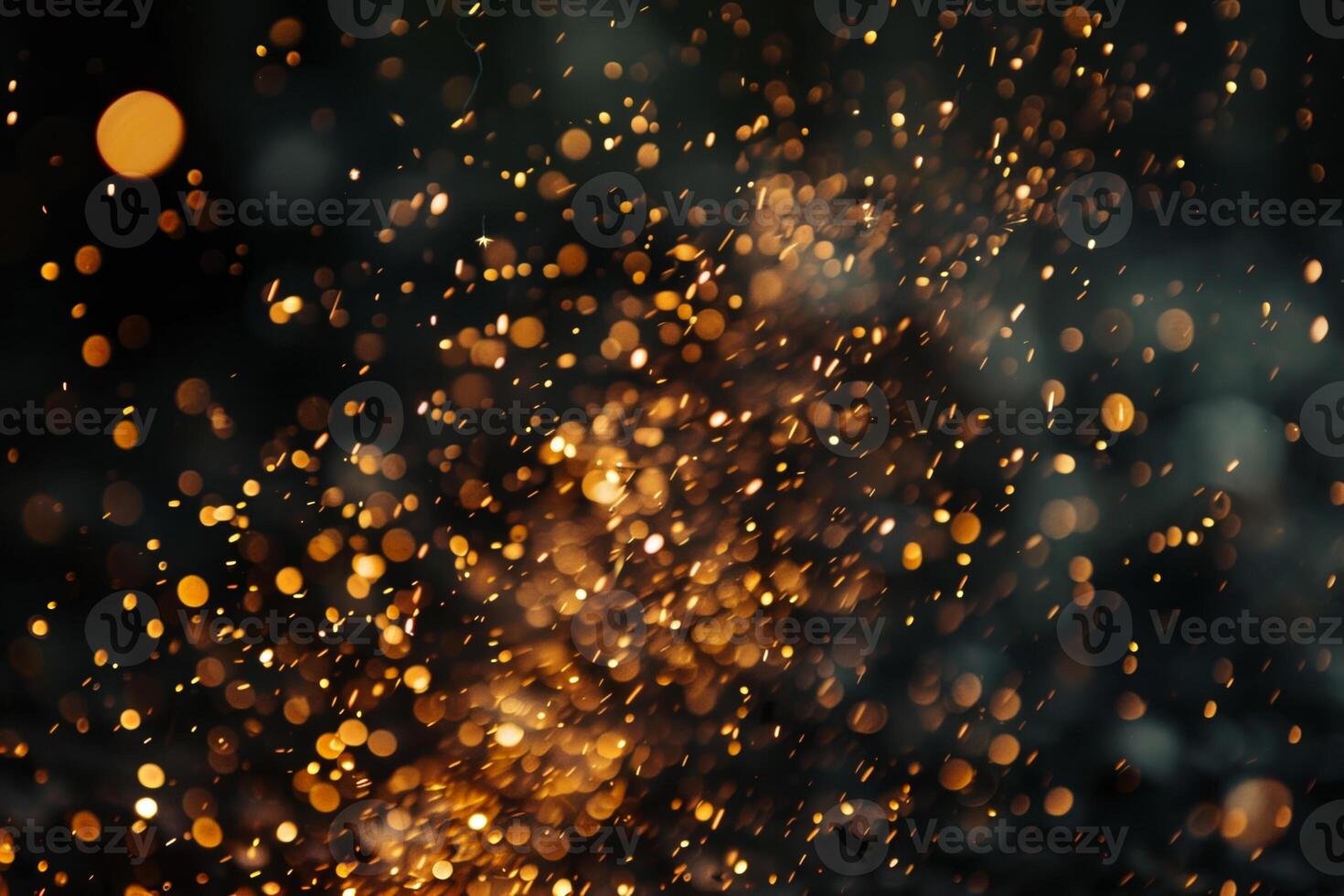As the night unfolds, golden sparks illuminate the darkness, swirling through the air. The scene radiates warmth and festivity, capturing a moment of celebration and joy photo