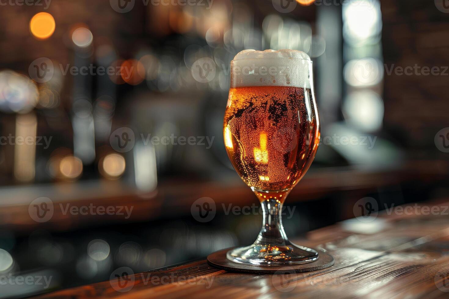 A beautifully poured glass of golden beer rests on a polished wooden surface, showcasing its frothy head as warm lights illuminate the inviting pub setting photo