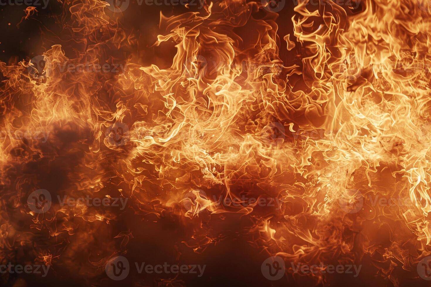 Bright orange and yellow flames swirl and flicker, creating a captivating display of heat and energy in a dramatic fire setting, showcasing the raw power of flames photo