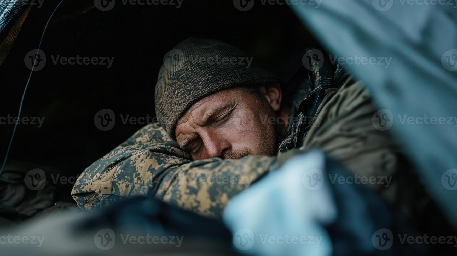 A man is sleeping in a tent photo