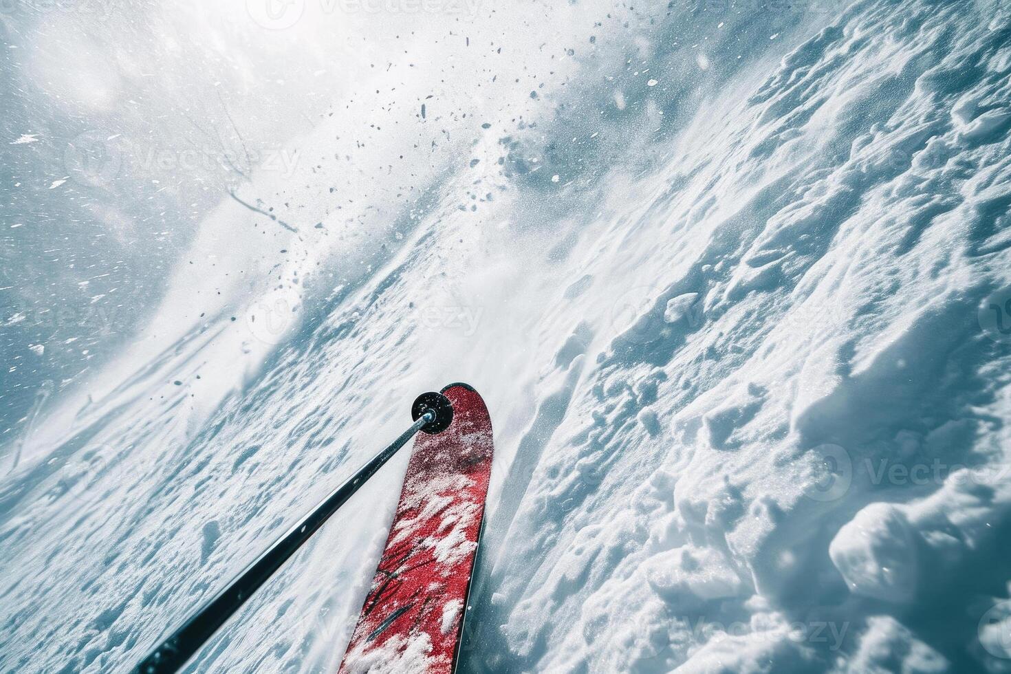 A skier is standing on the side of a snow covered slope photo