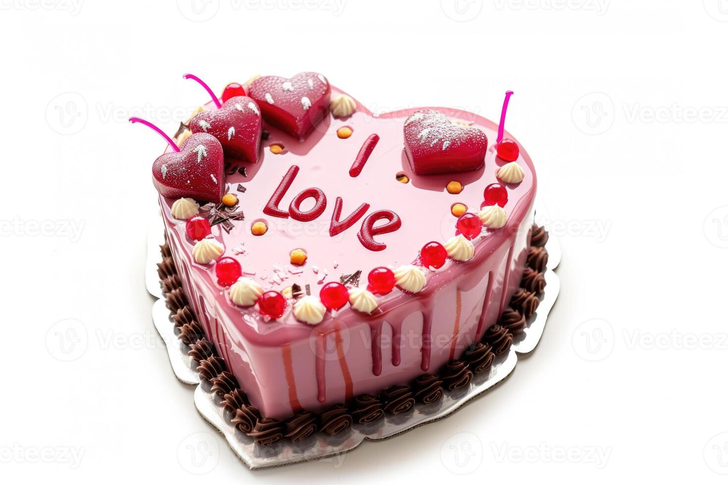 A pink heart shaped cake with the word i love on it photo
