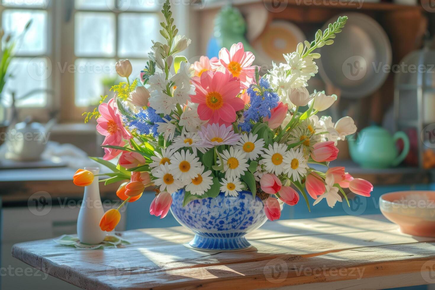 A vase of flowers on a table in a kitchen photo