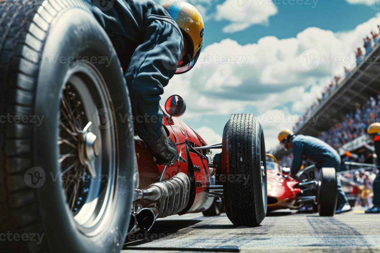 A man is working on a race car photo