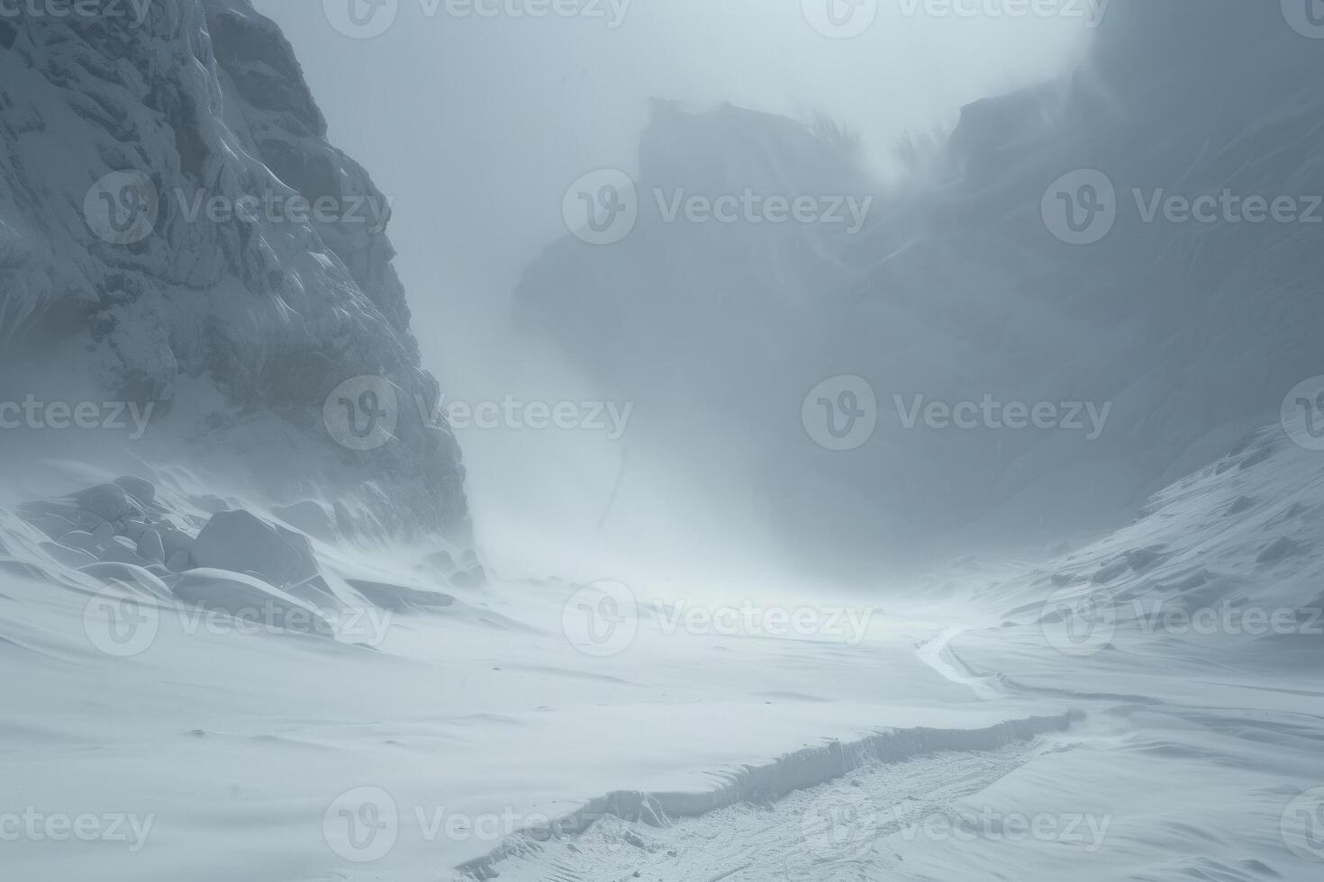 A snow covered mountain with a path leading to it photo