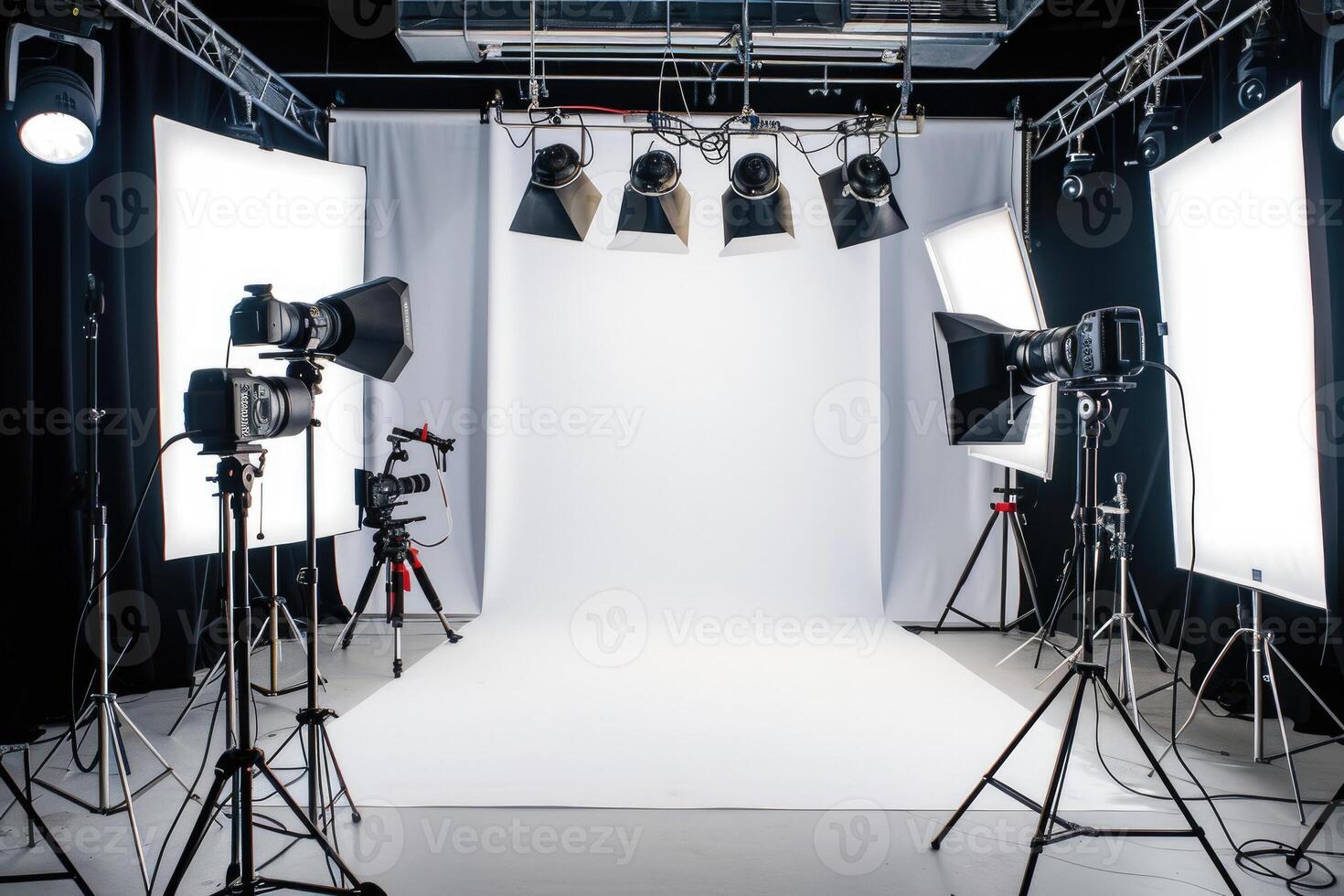 Photo studio with lighting equipment and white backdrop