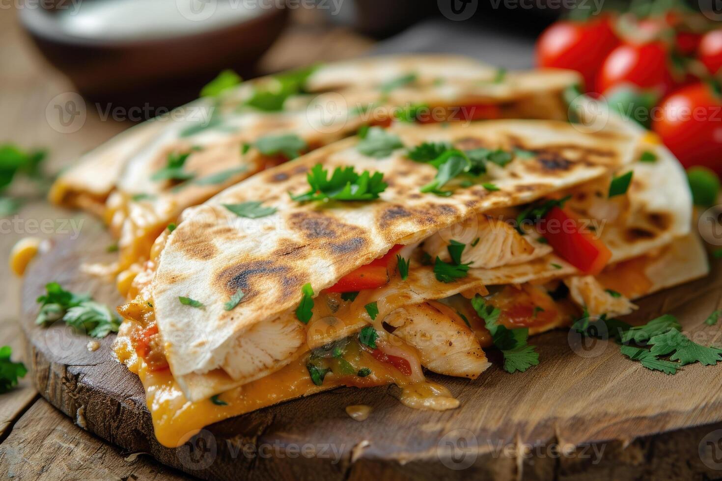 A quesadilla with chicken, cheese and tomatoes photo