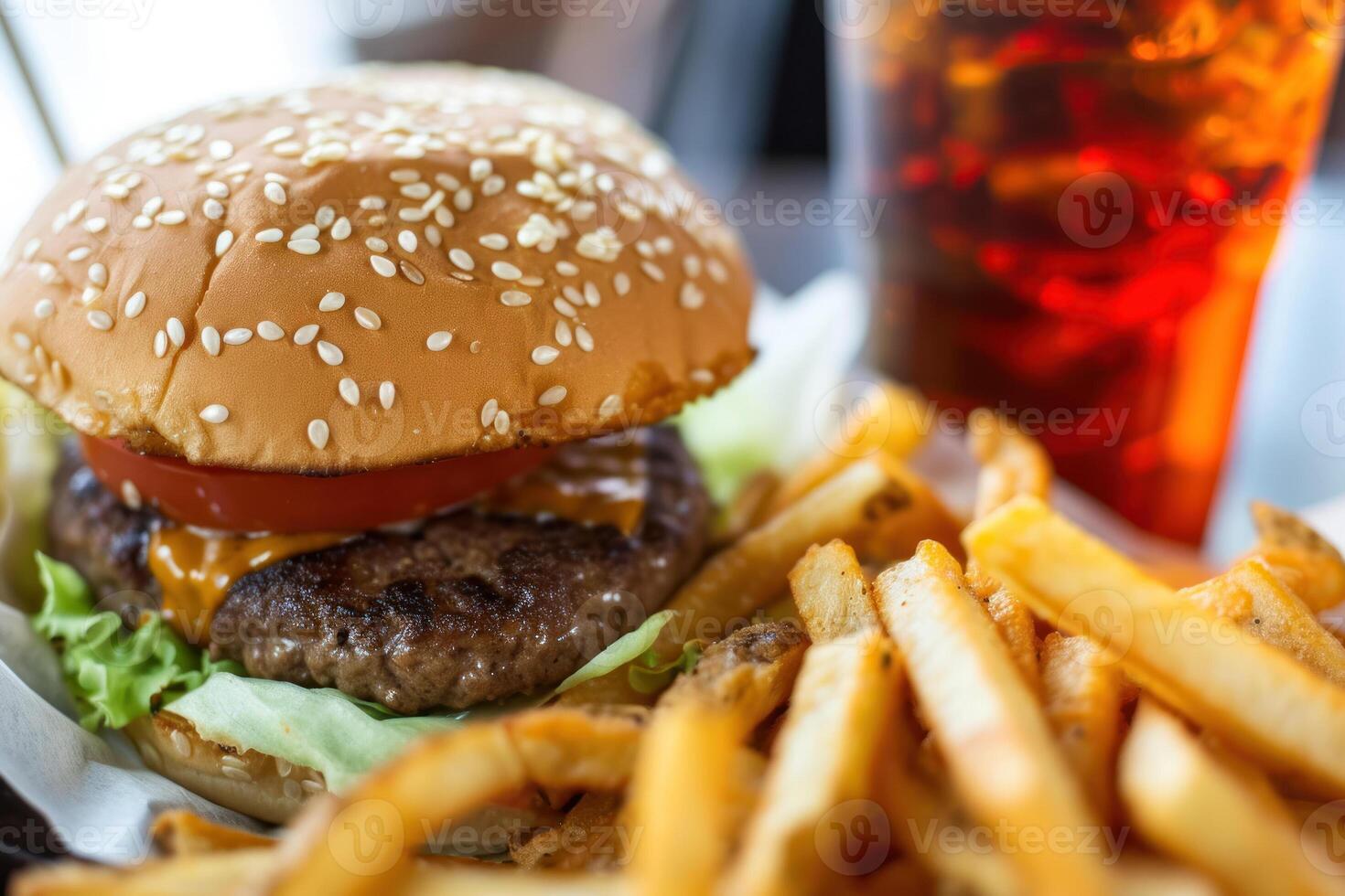 A hamburger and french fries are shown on a table photo