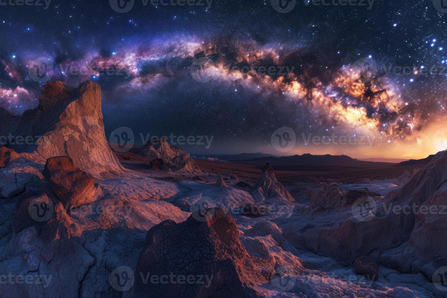 The milky way over a rocky landscape photo