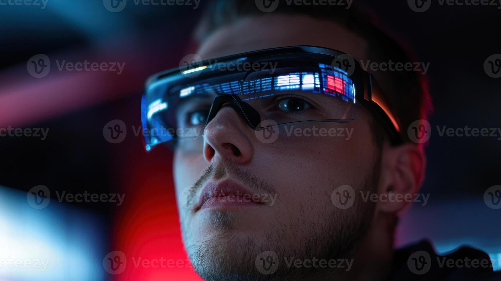 A man wearing a pair of glasses with a red light photo