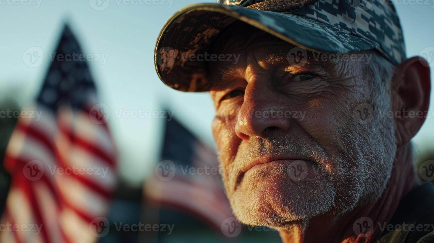 A man in a military uniform looks off to the side photo