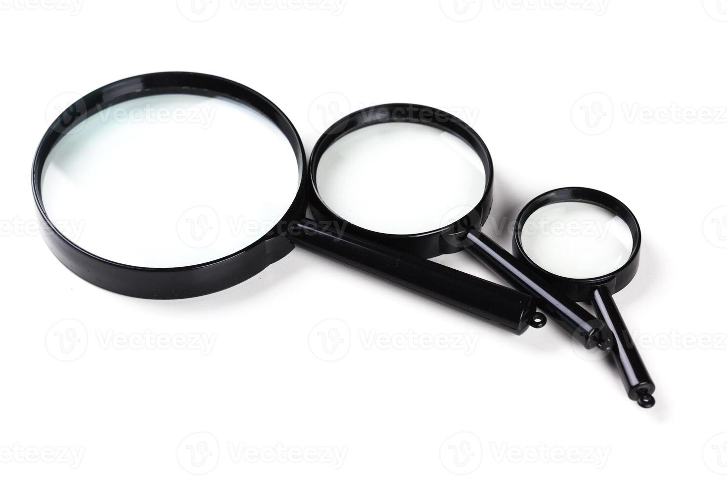 Three magnifiers over white photo