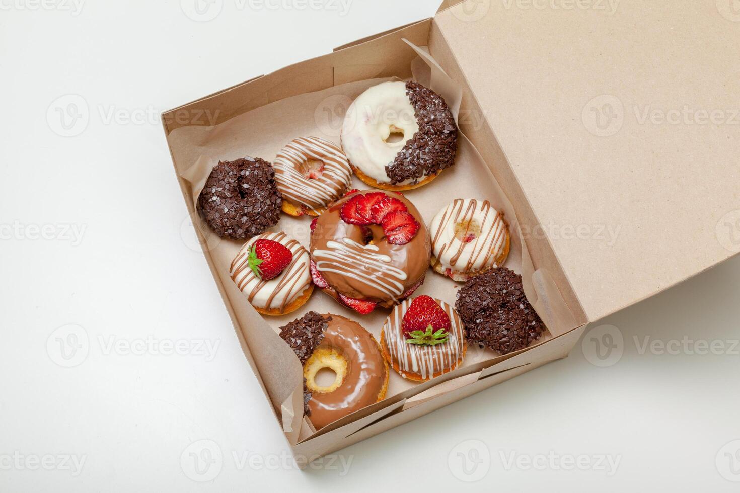 box of fresh donuts isolated on white photo